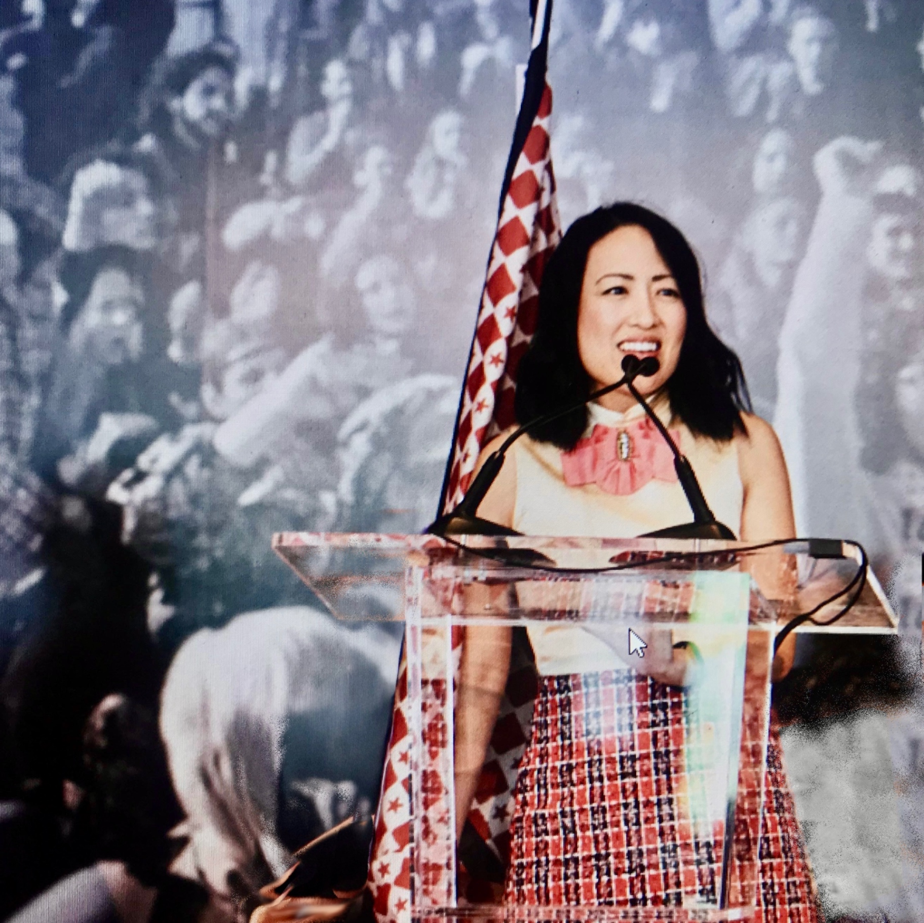 Tisha Clark speaking on stage with high-energy presence